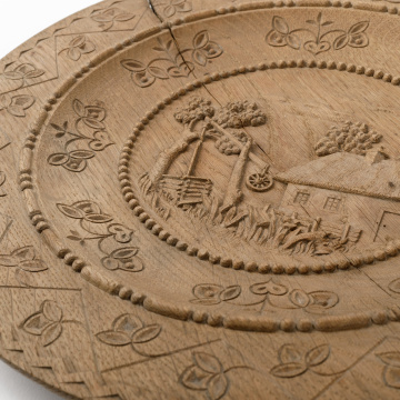 Carved wooden plate