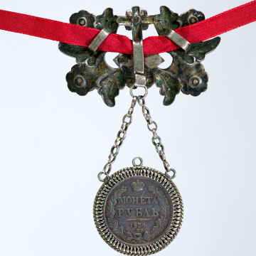 Large dukach (coin-shaped pendants) hung on a ribbon; worn as accessory