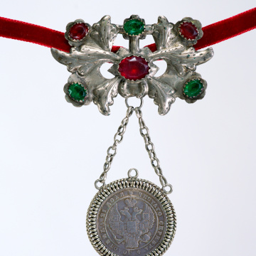 Large dukach (coin-shaped pendants) hung on a ribbon; worn as accessory