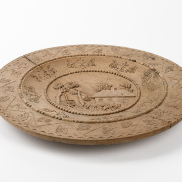 Carved wooden plate