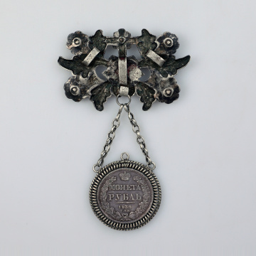 Large dukach (coin-shaped pendants) hung on a ribbon; worn as accessory