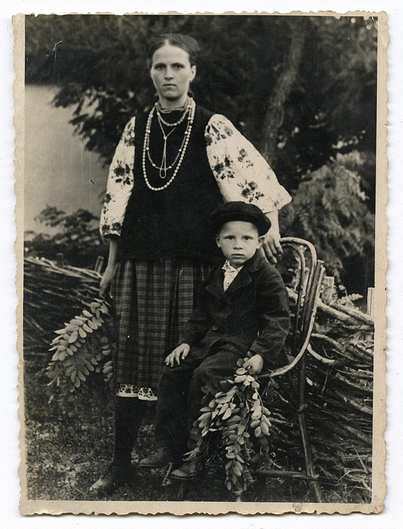 Woman in traditional attire and a boy
