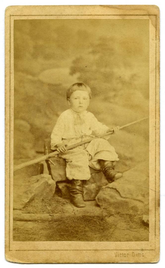Photo. A boy wearing stylised folk attire