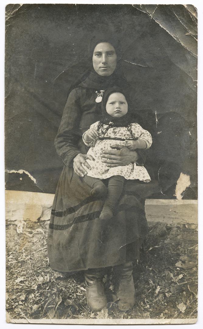 Woman with a little girl in her arms