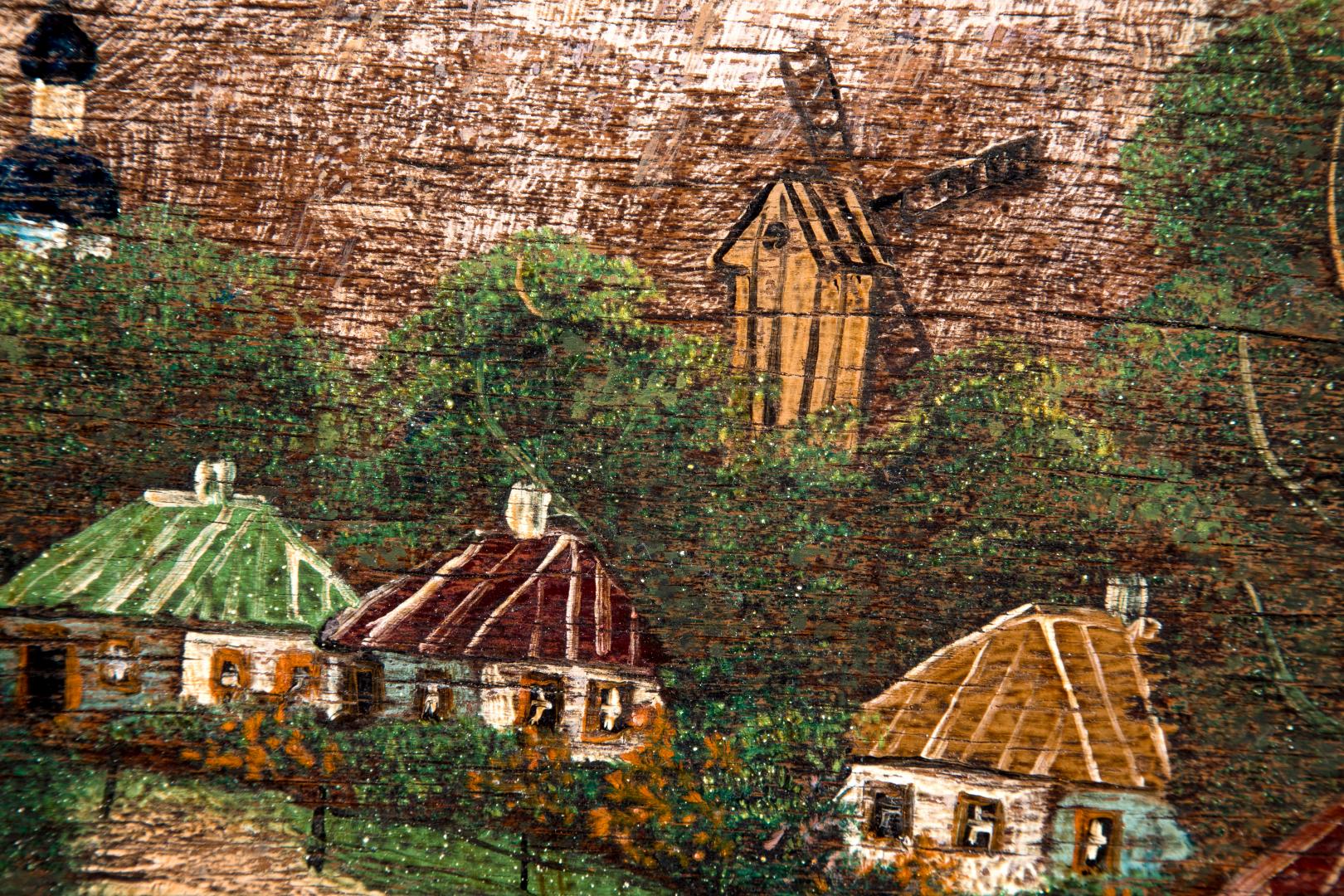 Landscape of the village with a church and a windmill