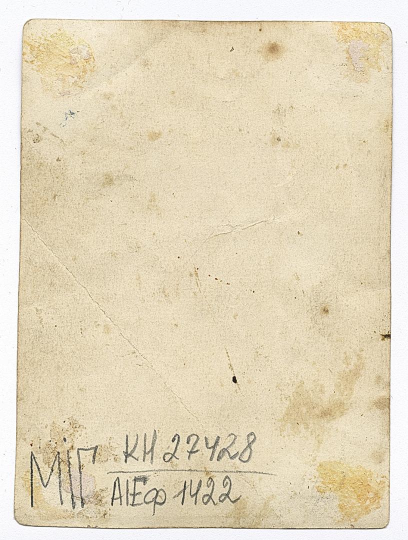 Two women and a man with wedding decor