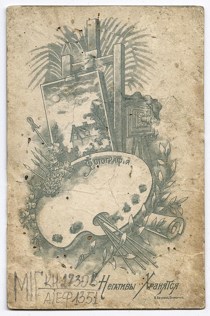 Man in World War I military uniform and two women in traditional attire