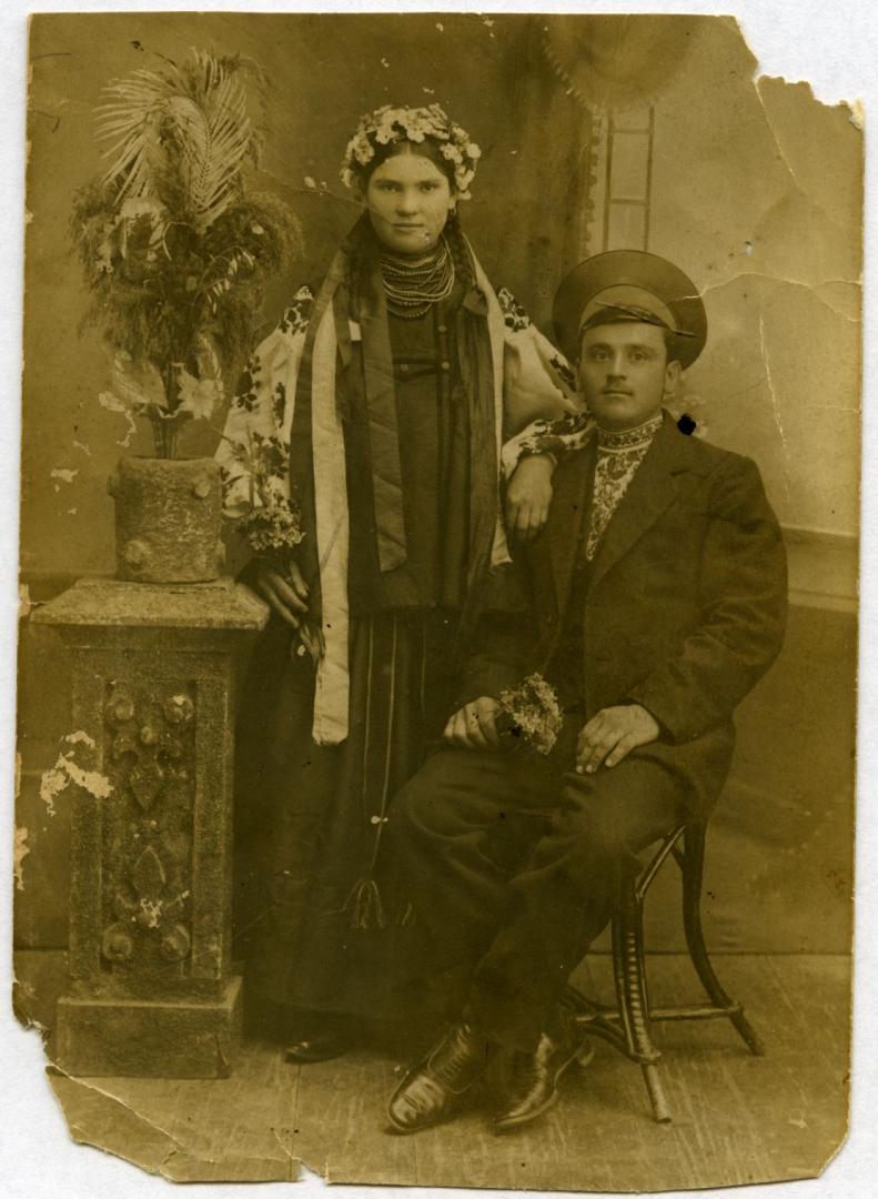 Photo. A young man and a girl wearing folk attire