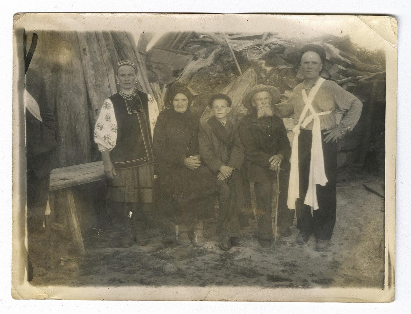 Group photo with a woman in traditional attire and a man belted with rushnyky
