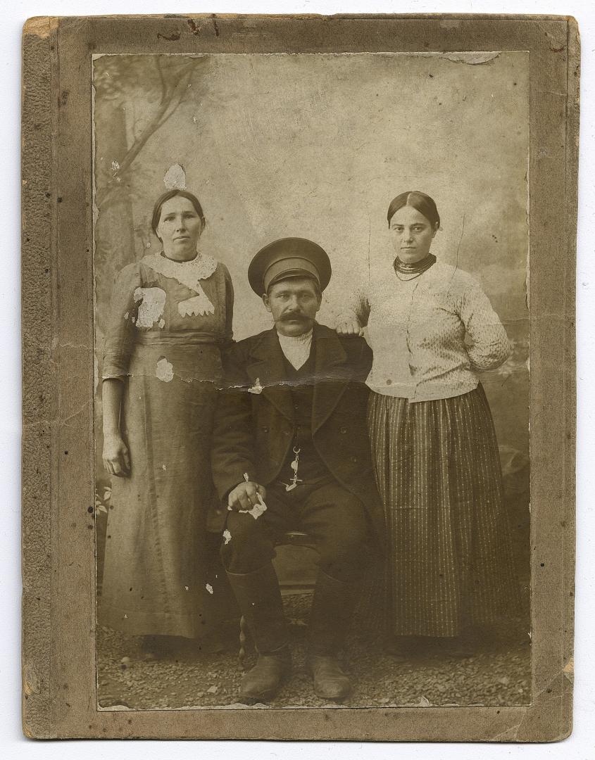 Man and two women in urban attire