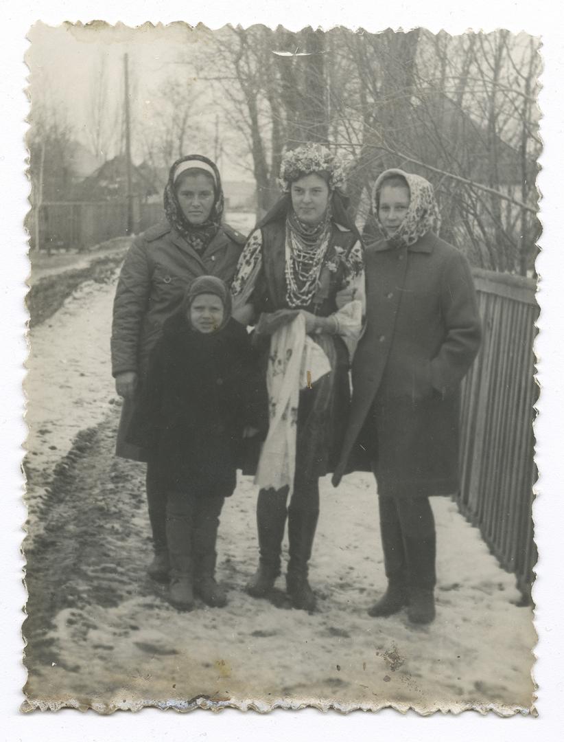 Bride, two women, and a boy