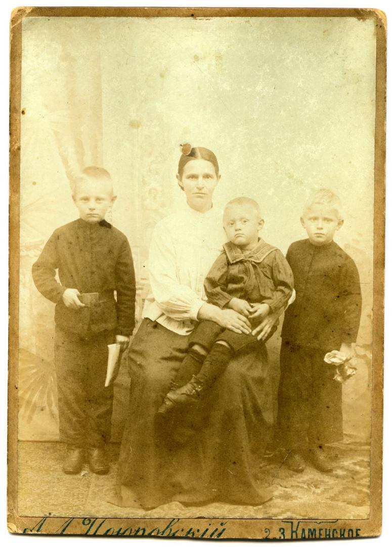 Photo. A mother with three sons