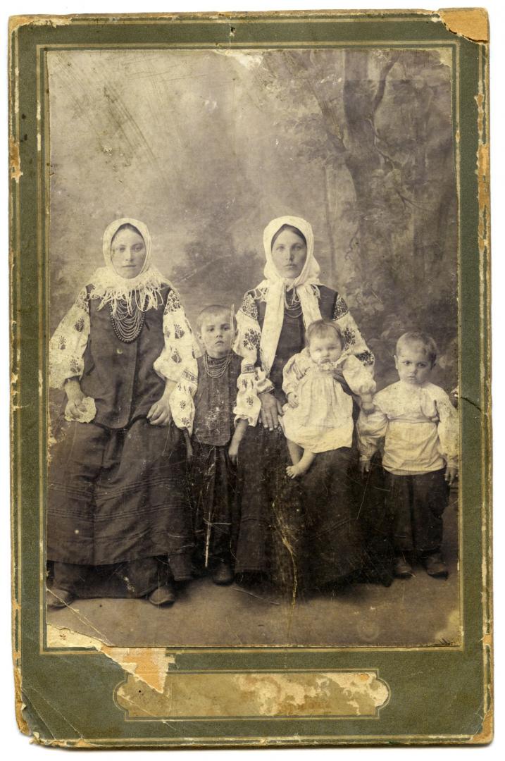 Photo. Women with children wearing folk attire