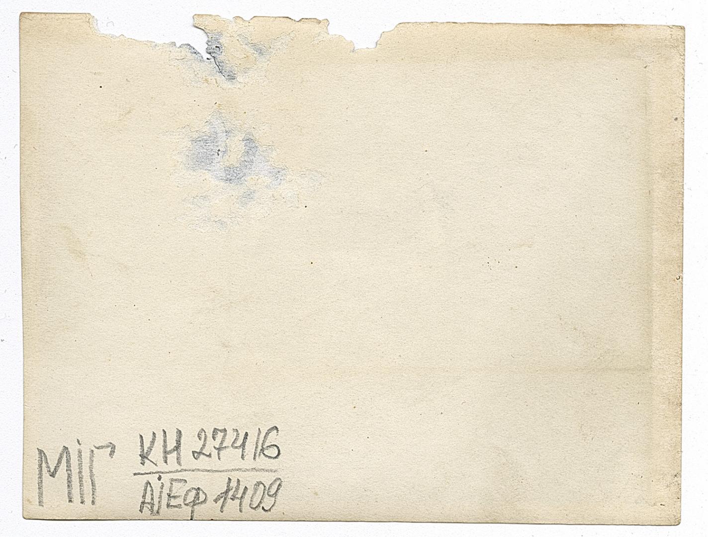 Two men and three women, one in an embroidered shirt