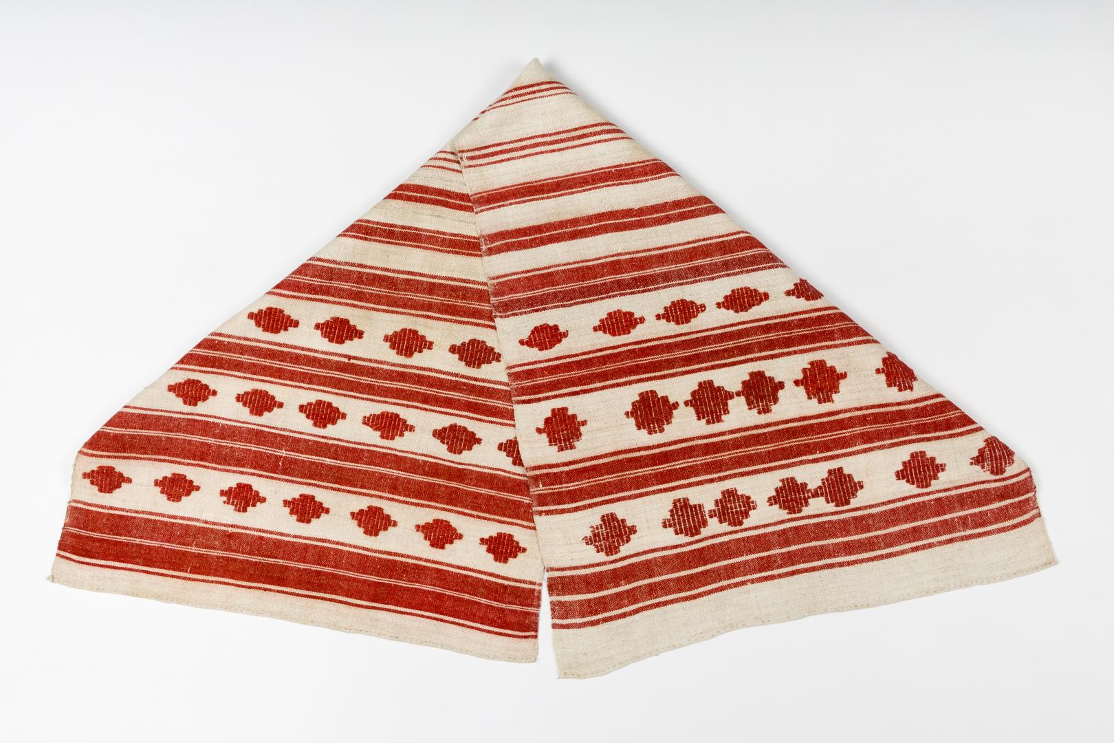 Woven rushnyk (towel) placed under a bread