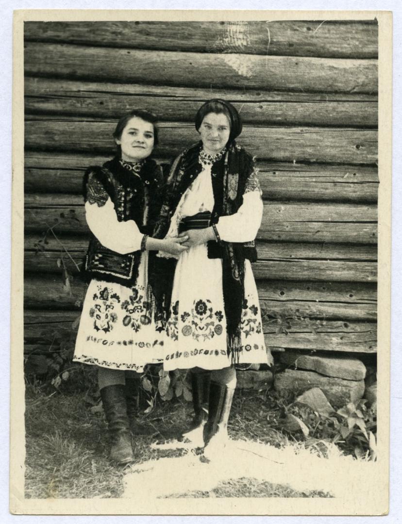 Photo. Two friends wearing festive folk attire