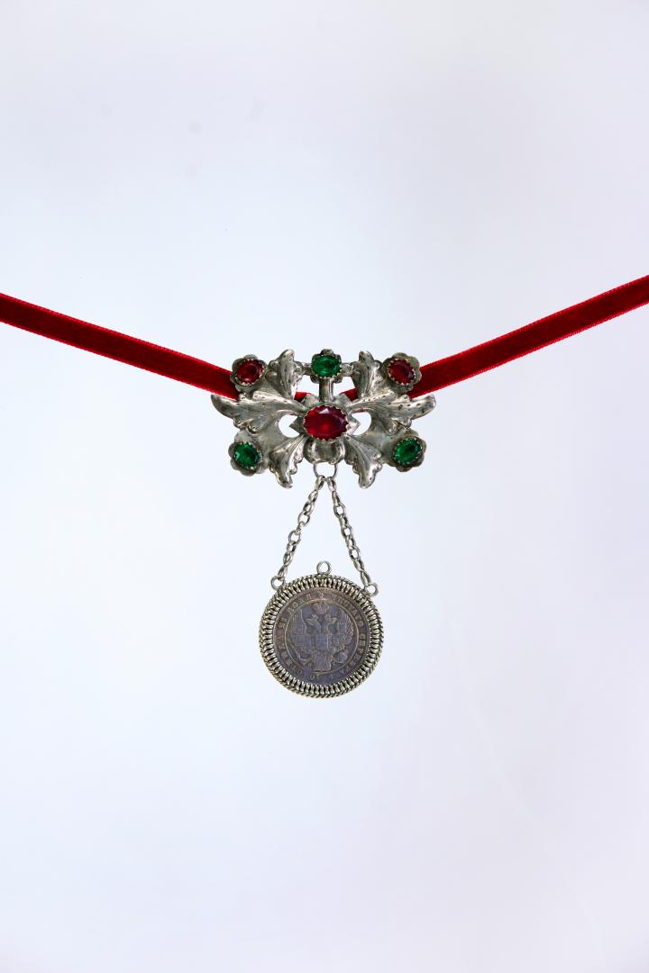 Large dukach (coin-shaped pendants) hung on a ribbon; worn as accessory
