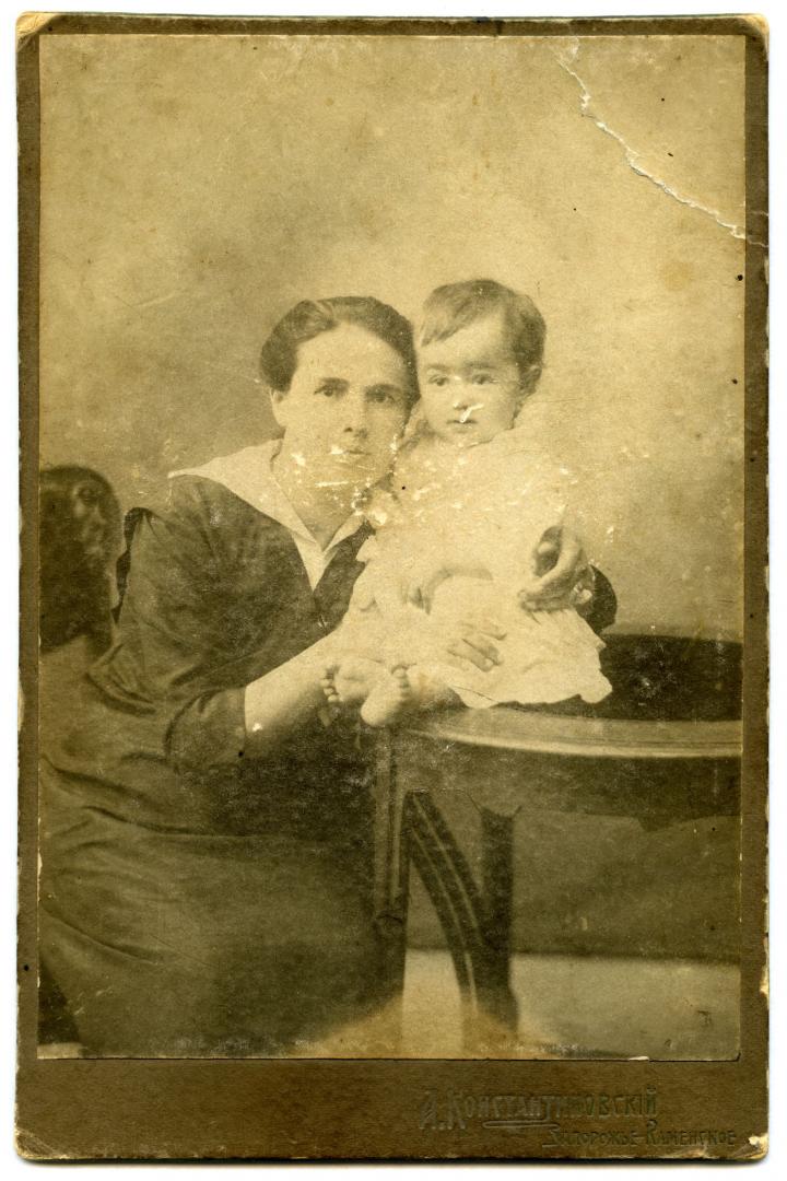 Photo. A young woman with a baby