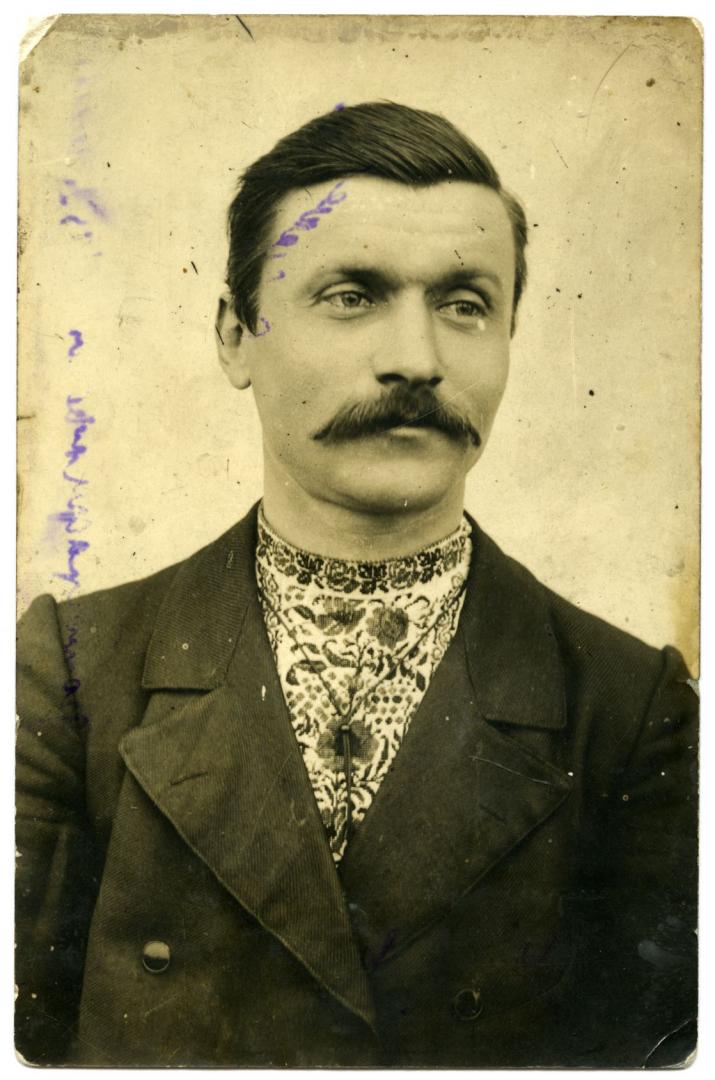 Photo. A portrait of a man wearing an embroidered shirt