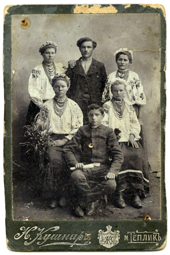 Photo. A family with children wearing folk attire