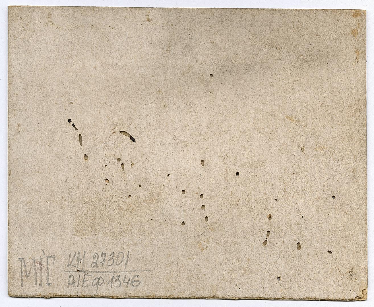 Two women in traditional attire and two men in embroidered shirts and vests