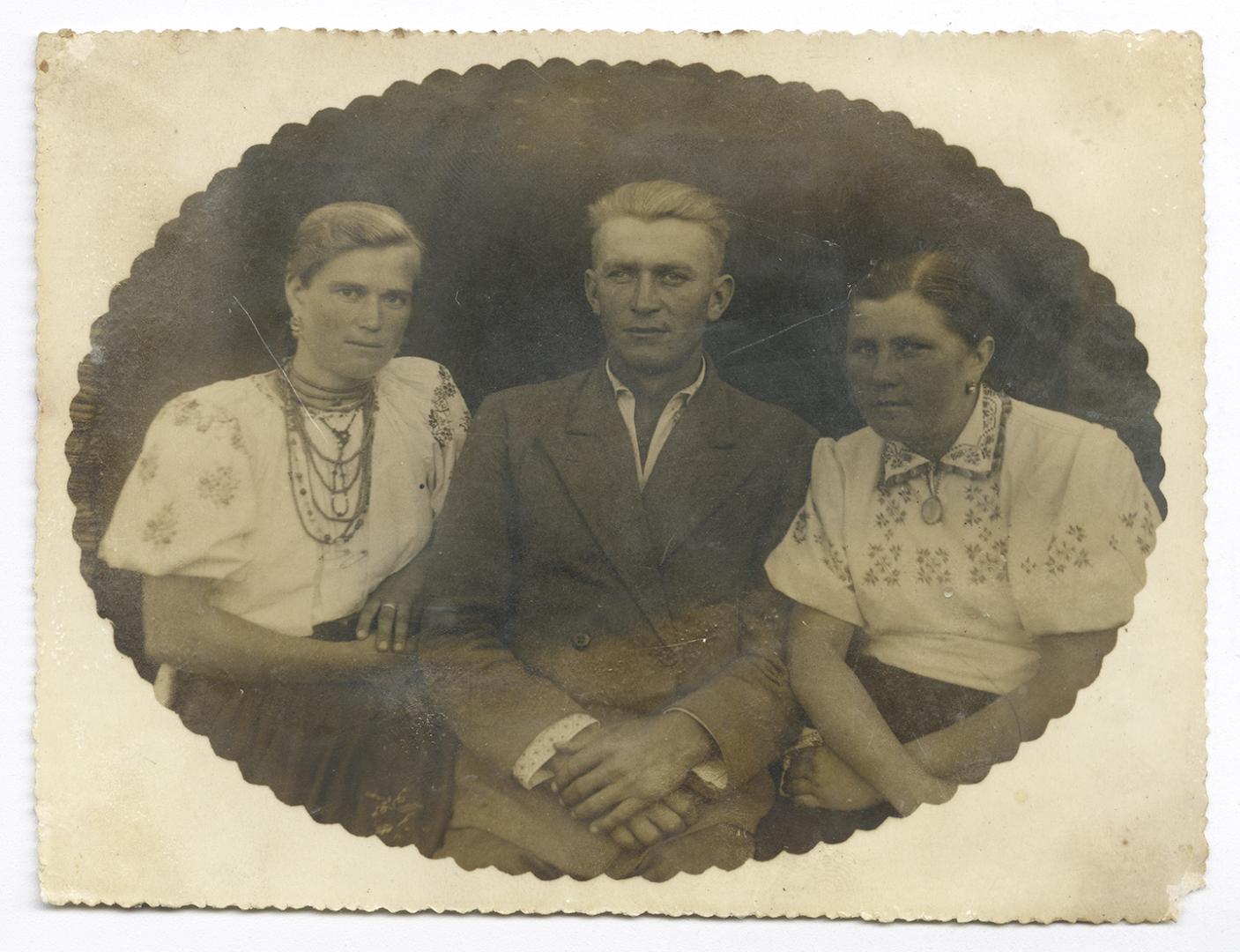 Family photo. Woman, girl, and man