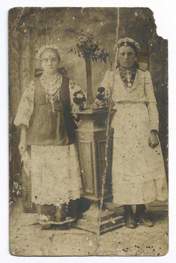 Two girls, one in traditional attire