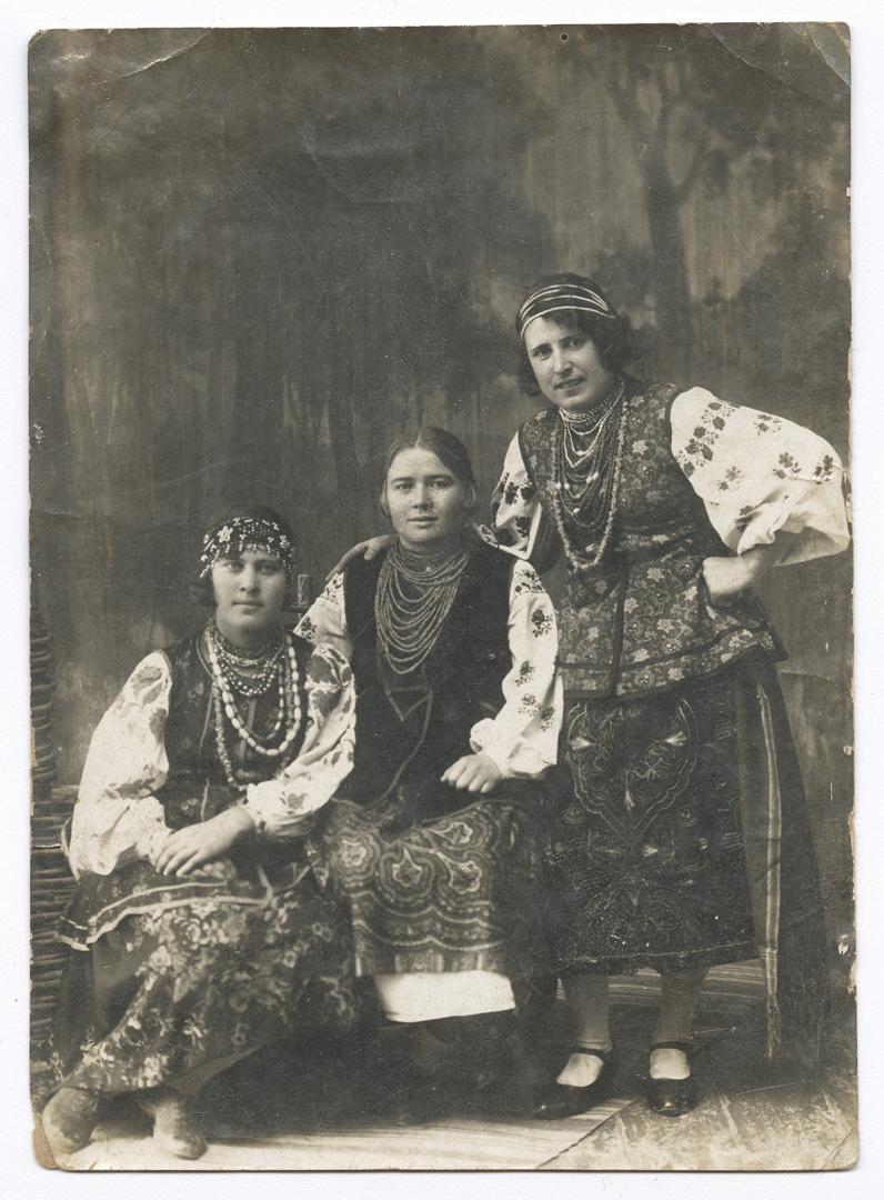 Woman and two girls in traditional attire