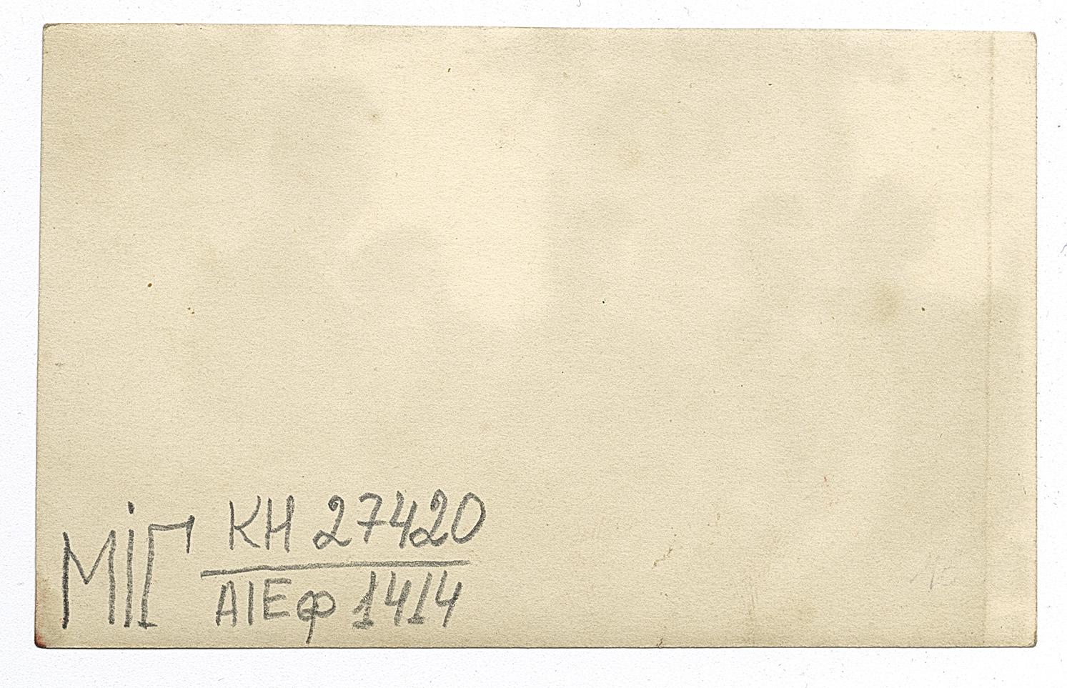 Men singing at a festive table, with icons draped in embroidered rushnyky