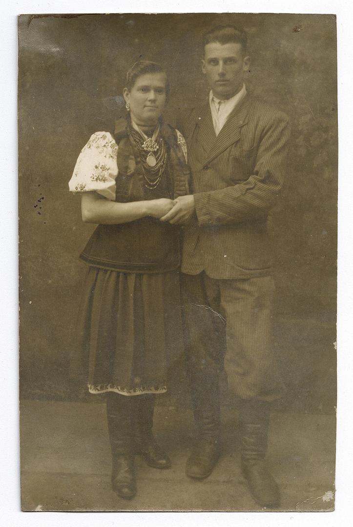 Young couple, girl in traditional attire