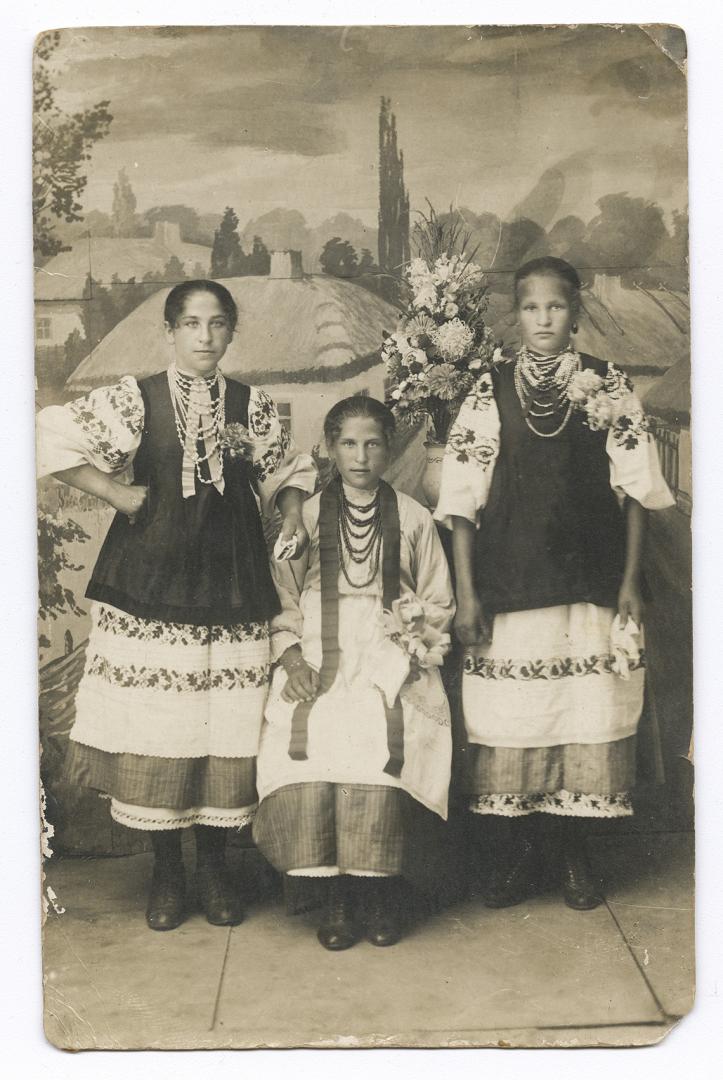 Three girls in traditional attire