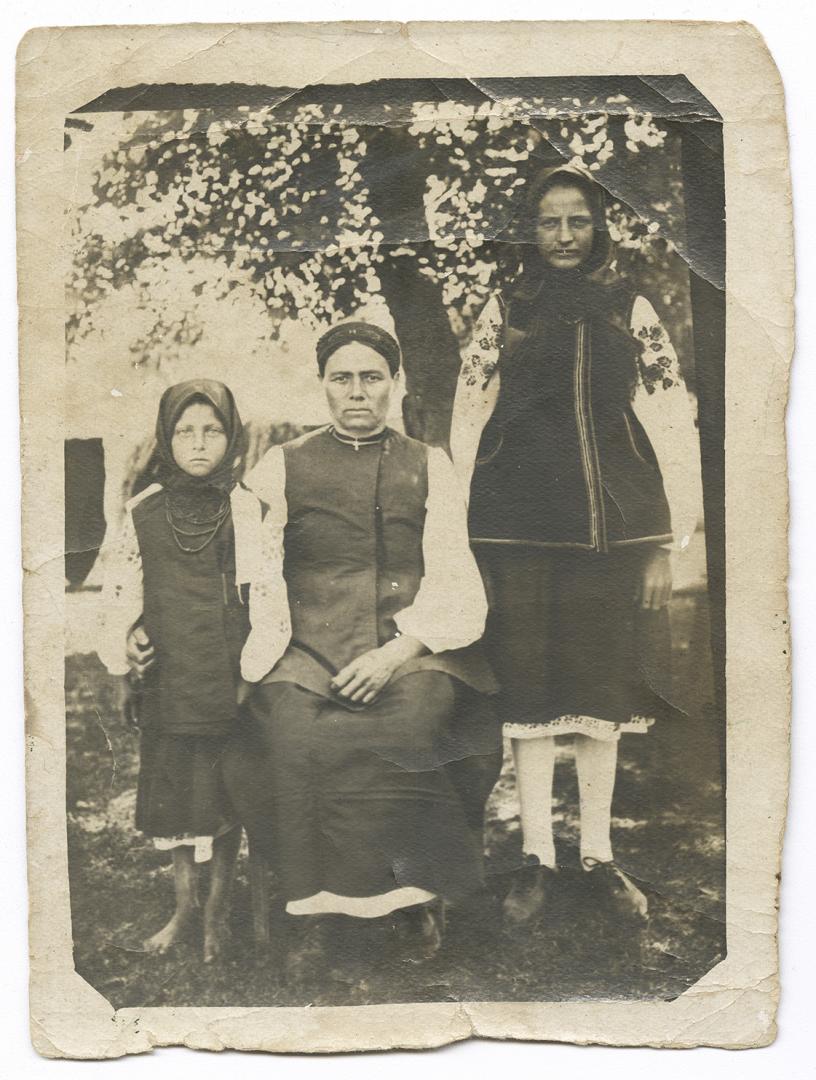 Two women and a girl in traditional attire