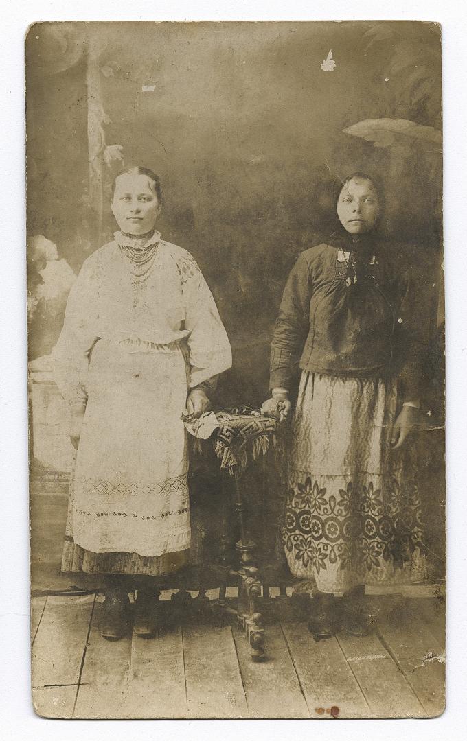 Two women, one in traditional attire