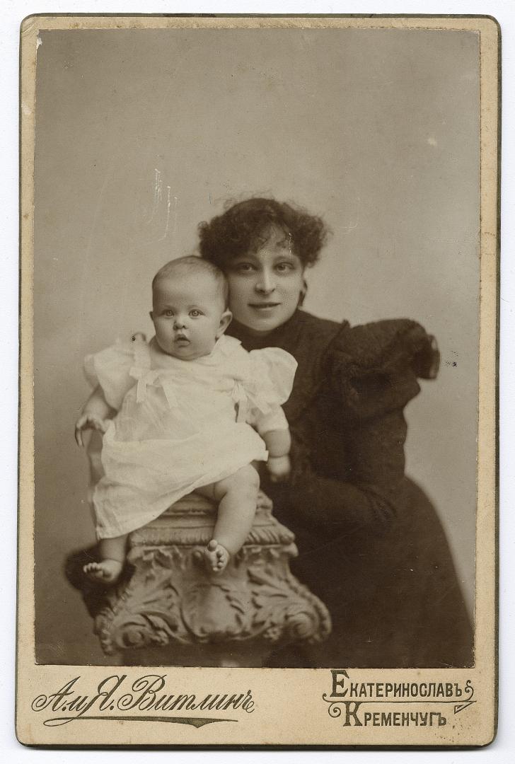 Woman in bourgeois attire with a child