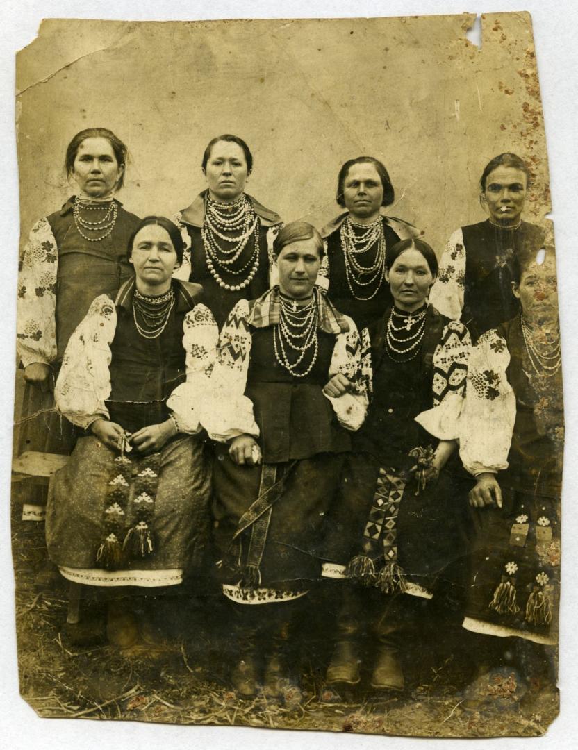 Photo. A group of women wearing folk attire. 