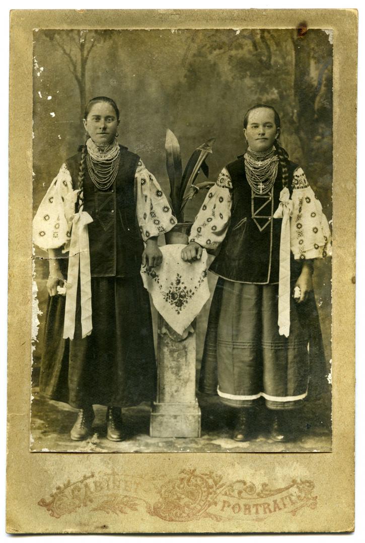 Photo. Two girls wearing folk attire