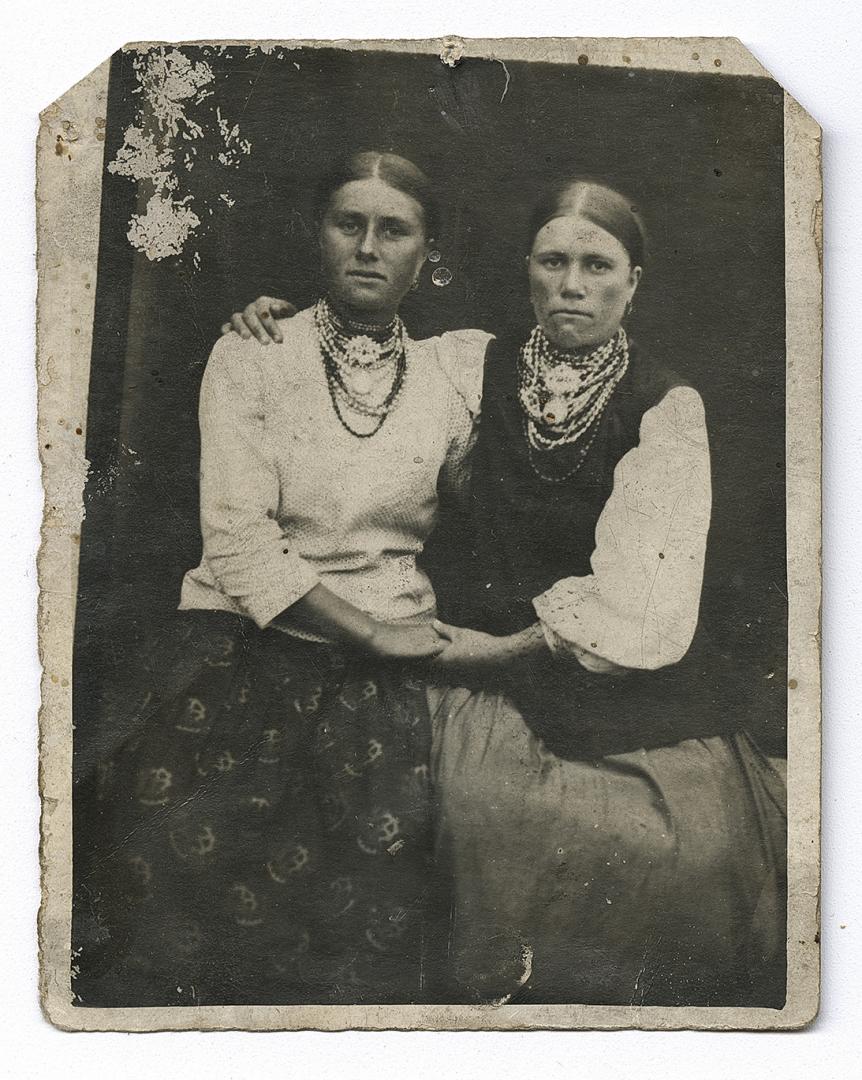 Two girls, one in traditional attire