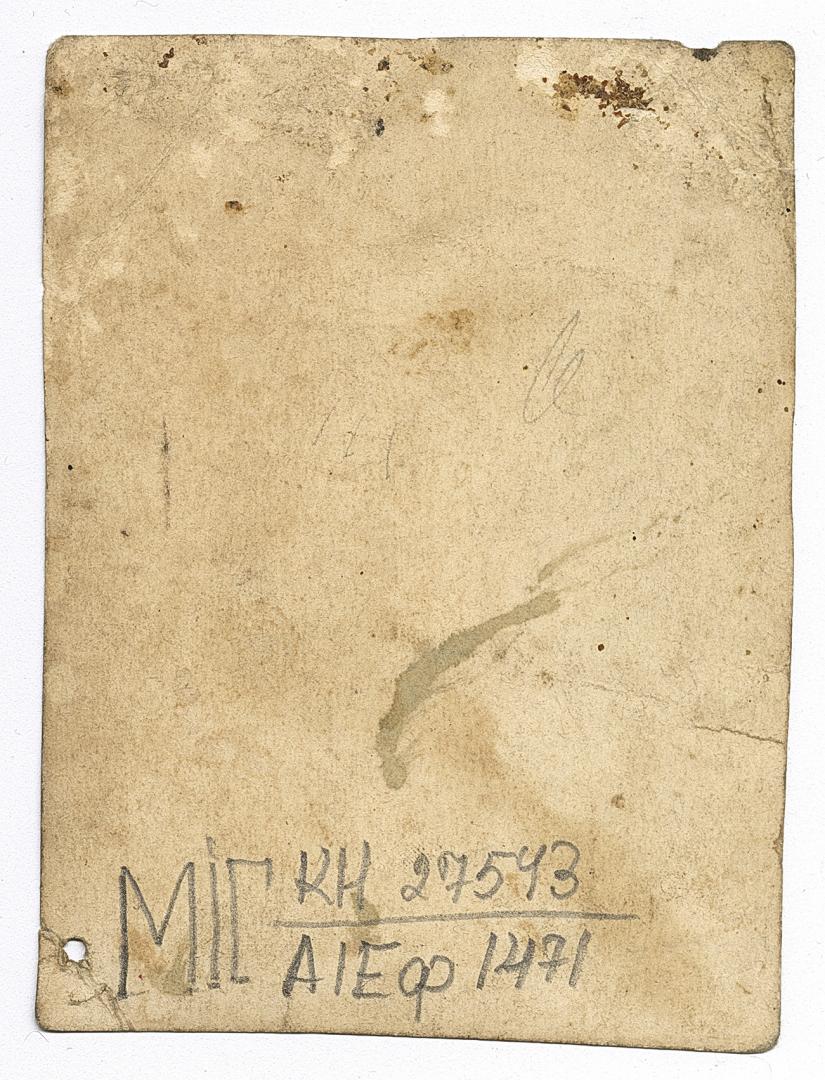 Two men in embroidered shirts under outerwear and two women, one in traditional attire