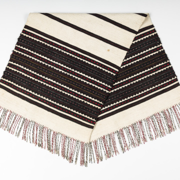 Woven rushnyk (towel) placed under a bread