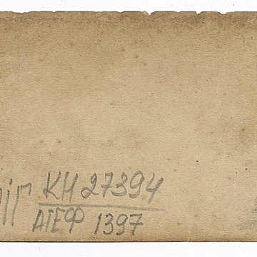 Three men on a crawler tractor