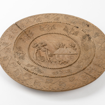 Carved wooden plate